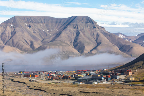 Colorful houses of Longyearbyen town in Svalbard on a cloudy day.