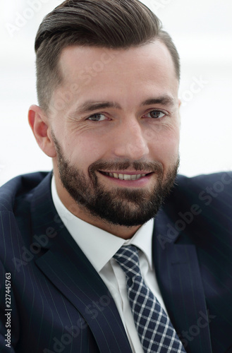 successful businessman sitting in a chair.