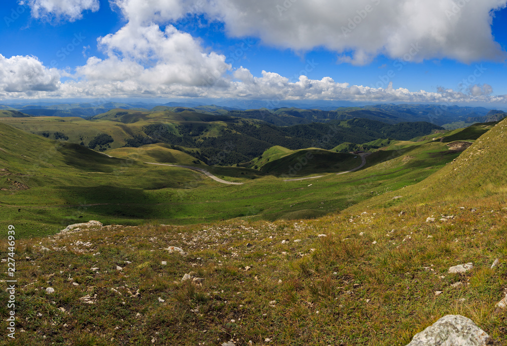 Clouds over the hills in the area of Mount Elbrus. Photographed in the Caucasus, Russia. Clouds over the hills in the area of Mount Elbrus. Photographed in the Caucasus, Russia.