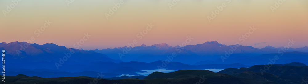 Panoramic view of the dawn in the mountainous part of the rocky ridge of the North Caucasus in Russia.