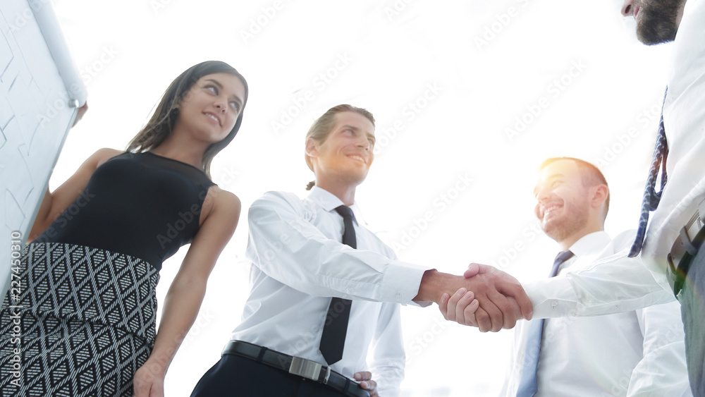 handshake business colleagues after discussing the new presentation.