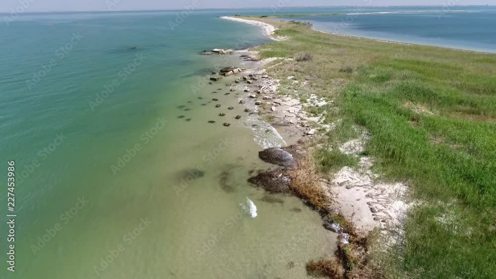 custom made wallpaper toronto digitalRemains of destroyed buildings on the shores of the beautiful sea. The waves wash the ruins. A family of three sailed on a boat on the island to relax. The shoreline, white sand, algae.