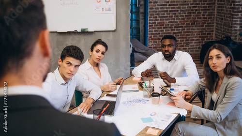 Business conference. Business meeting. Business people in formalwear discussing something while sitting together at the table. startup