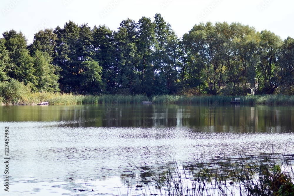 Lake near the park in a medieval city Lake near the park in a medieval city