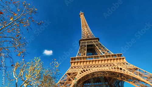 Upward view of Eiffel Tower on a beautiful sunny winter day - Paris - France © jovannig