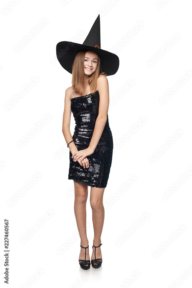Full length playful Halloween witch isolated on white background Full length playful Halloween witch isolated on white background