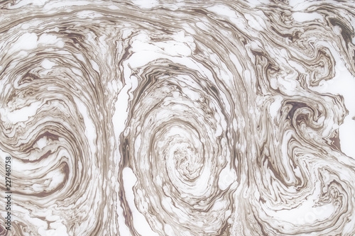 Abstract monochrome marble background. Stains of paint on the water.