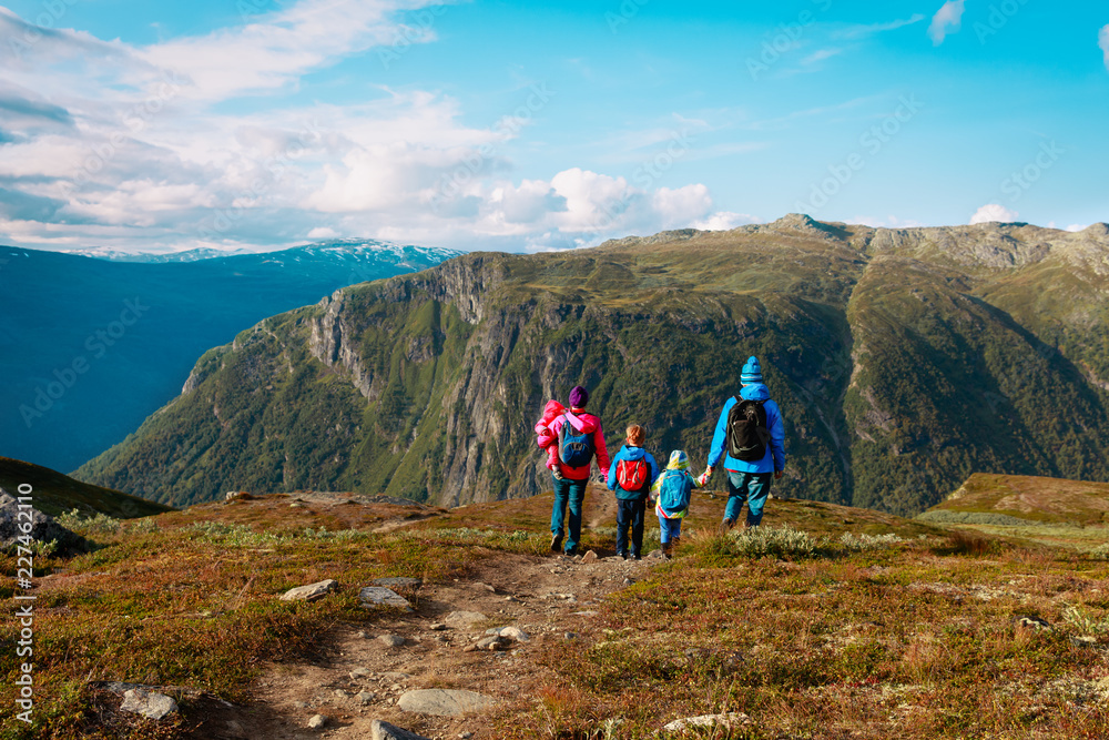 family with kids hiking travel in scenic mountains, Norway