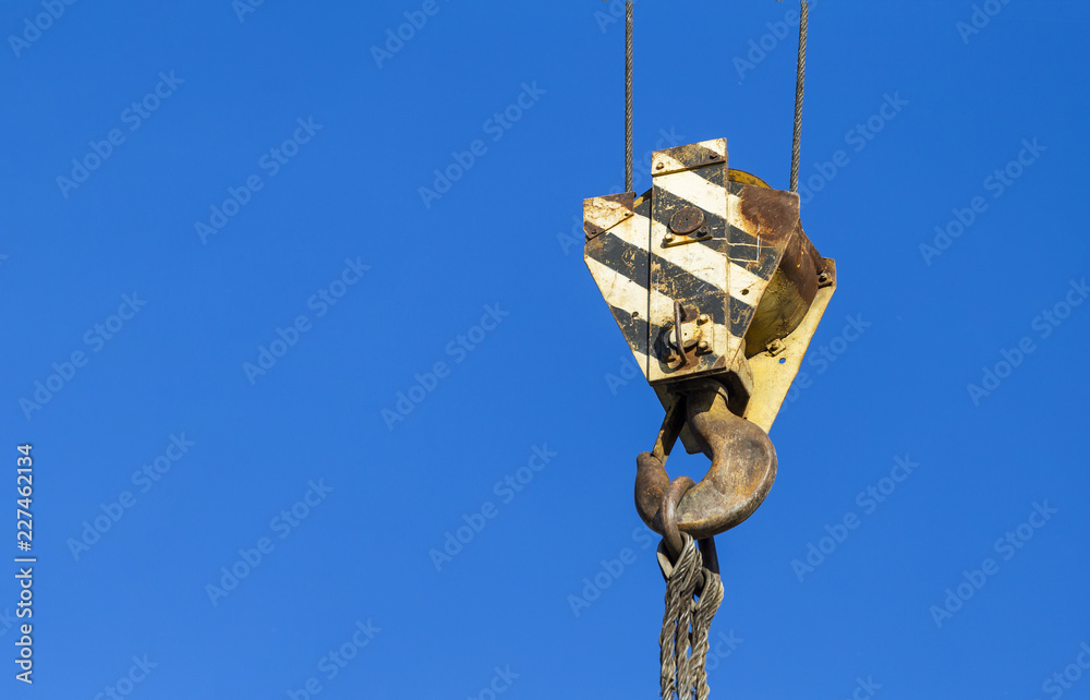 Hook construction crane on blue sky background Hook construction crane on blue sky background
