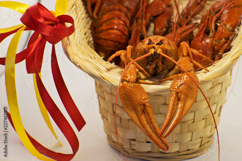 Boiled crayfish in basket. Tasty fresh boiled crawfish. Men's holiday gift. photo