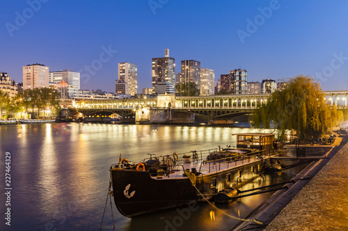 France, Paris, Pont de Bir-Hakeim, Seine river, modern high-rise buildings at blue hour photo