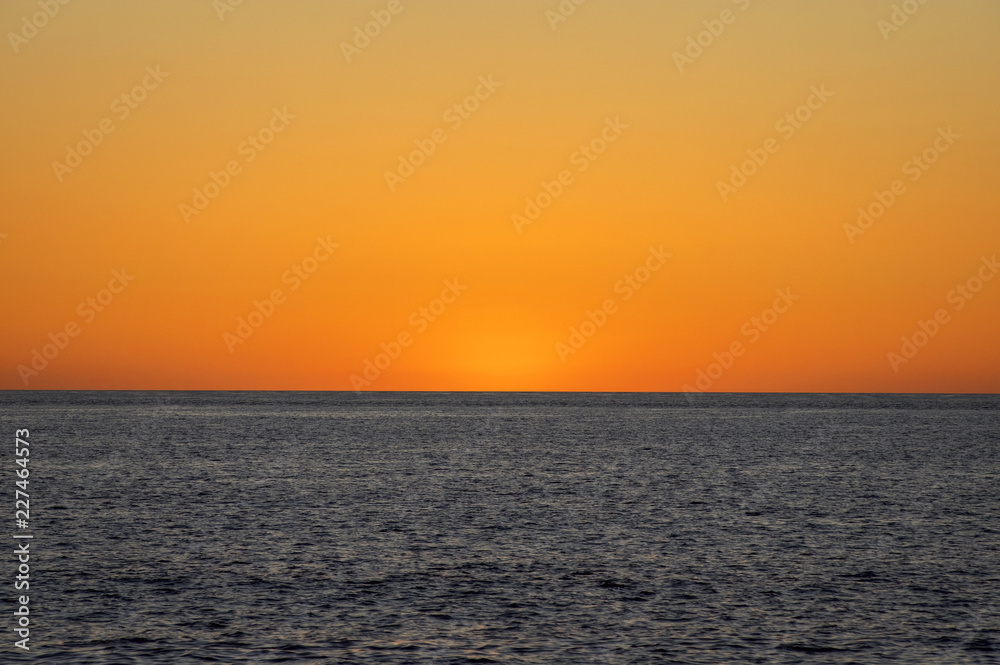 Western Australia – sunset at the Indian Ocean with clear sky at the horizon at a beach at Cape Leveque