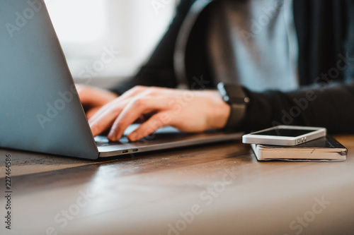 Man typing on a laptop