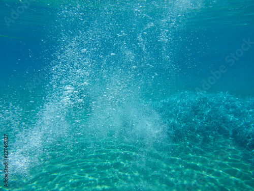 Abstract background of underwater bubbles in Kolona double bay Kythnos island Cyclades Greece, Aegean sea.