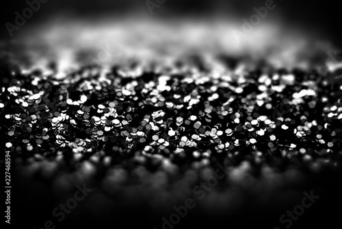 Foto Abstract black glitter background, shallow depth of field.