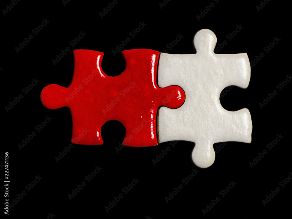 red jigsaw puzzle and white jigsaw puzzle on black background red jigsaw puzzle and white jigsaw puzzle on black background
