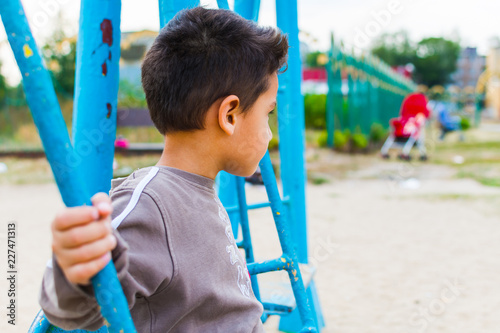 boy swinging on a swing