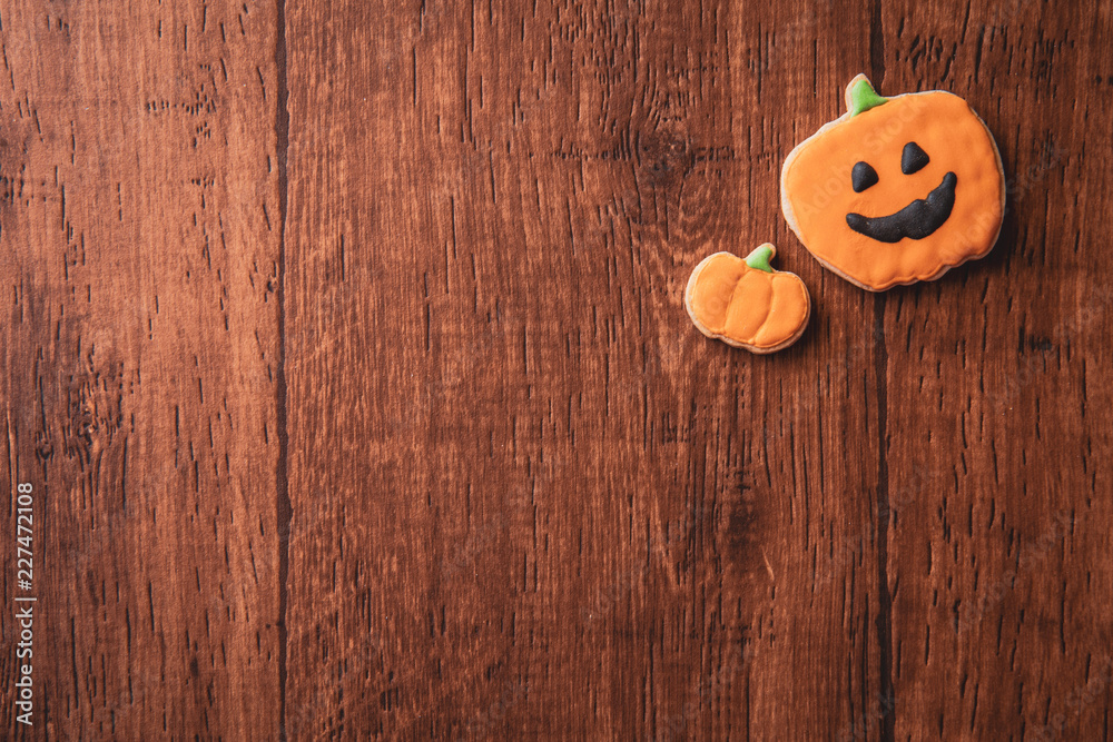 Fresh delicious homemade decorated halloween cookies sweets on dark wooden background, concept of halloween party, copy space(text space), top view, blank for text. Fresh delicious homemade decorated halloween cookies sweets on dark wooden background, concept of halloween party, copy space(text space), top view, blank for text.