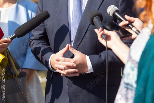 Reporters making press interview with politician or business person © wellphoto
