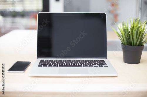 Laptop and mobile phone on ...