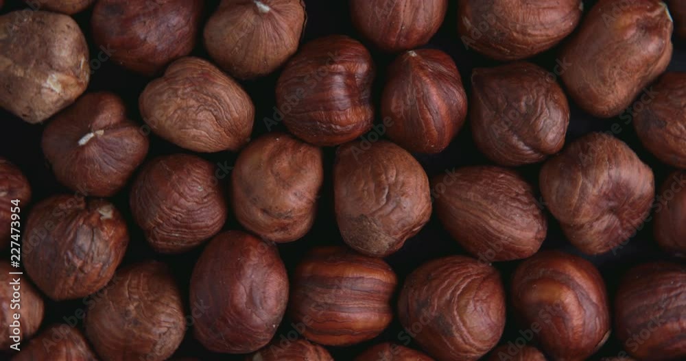 Hazelnut closeup. Rotating nuts background Hazelnut closeup. Rotating nuts background