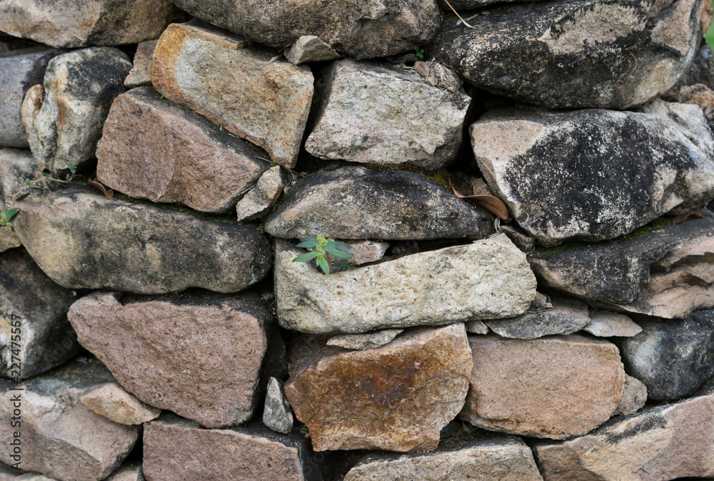 Stack of many size rock wall.