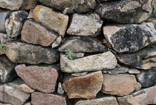 Stack of many size rock wall.