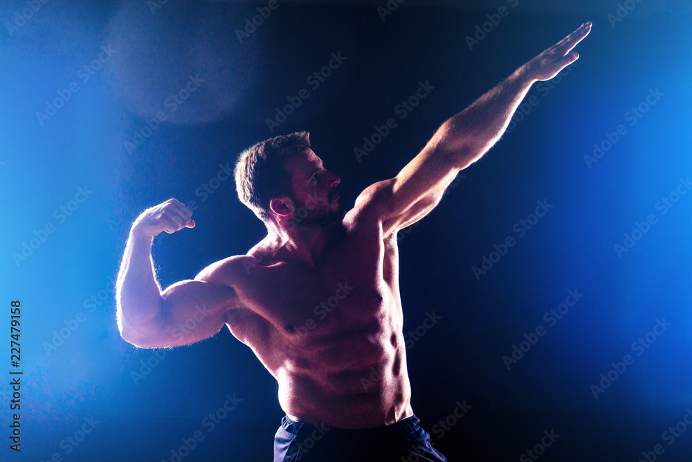 Muscular torso of sexy young fitness male bodybuilder model power athletic  man antique statue with perfect muscles six pack abs and bare nude chest  posing on dark background Stock Photo | Adobe