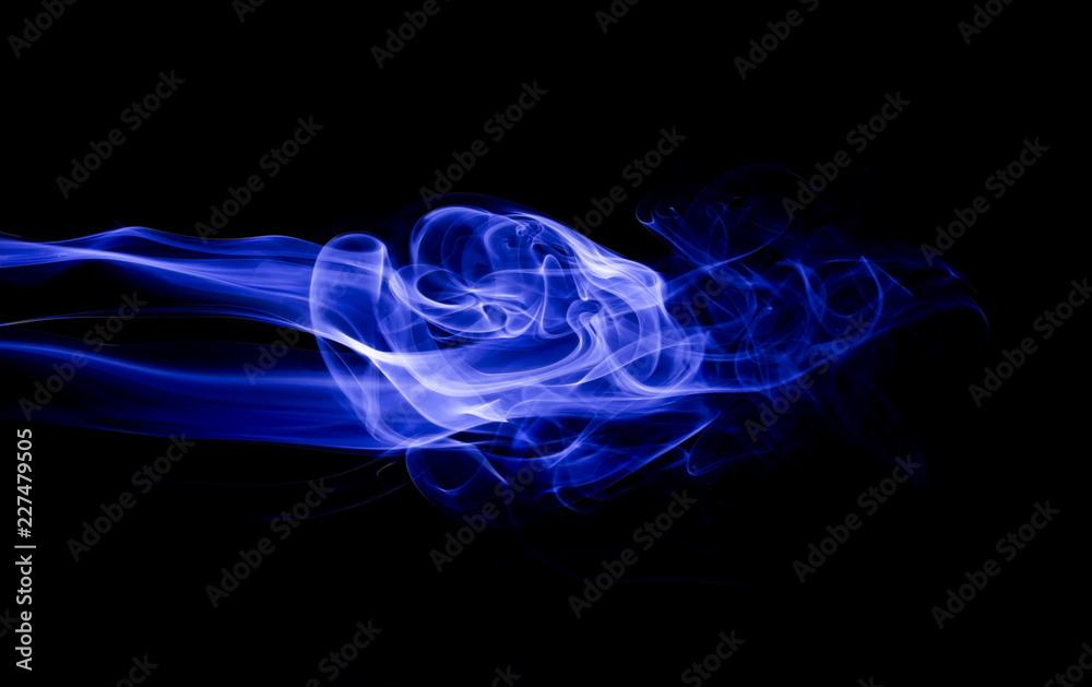 Fototapeta premium Blue smoke on black background