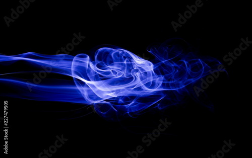 Blue smoke on black background