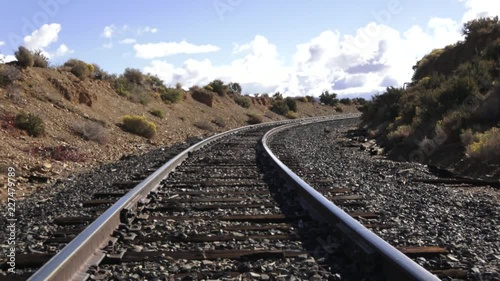 Clouds moving over railroad tracks from a mid level view