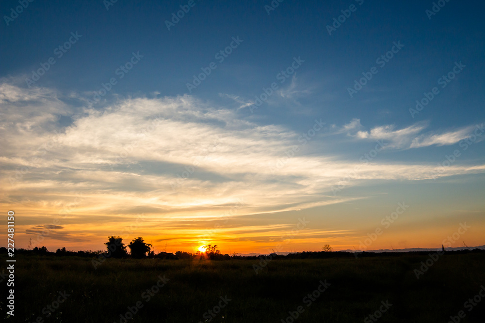 colorful dramatic sky with cloud at sunset.