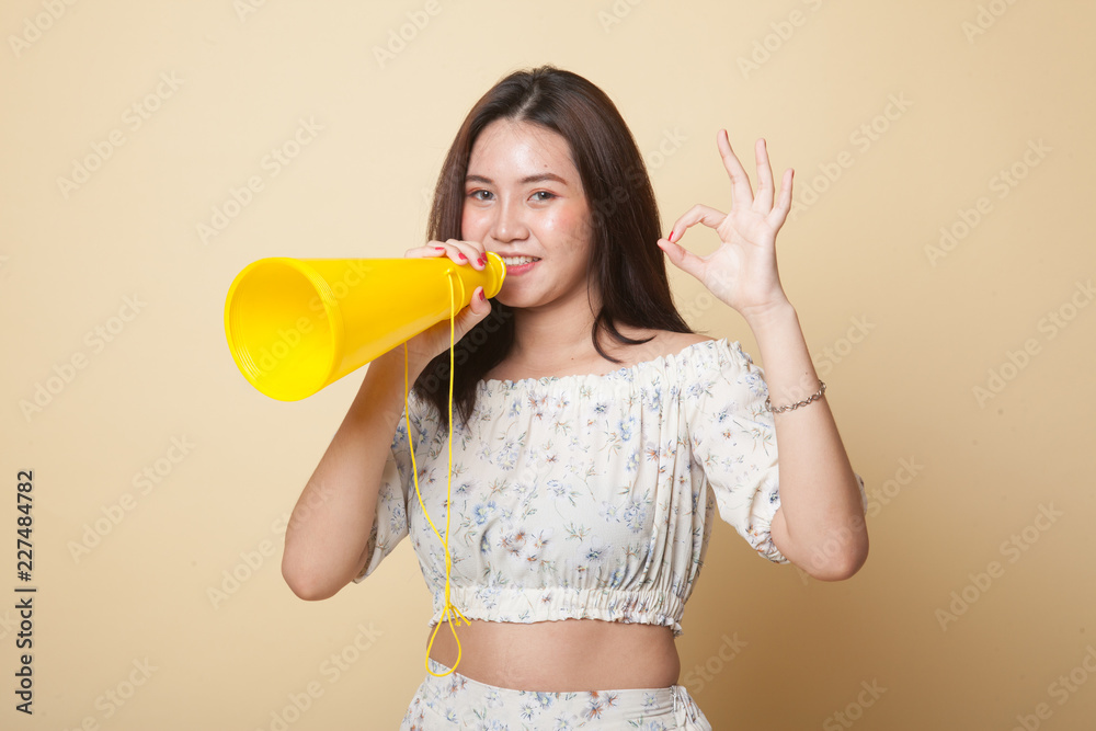 Beautiful young Asian woman show OK announce with megaphone. Beautiful young Asian woman show OK announce with megaphone.