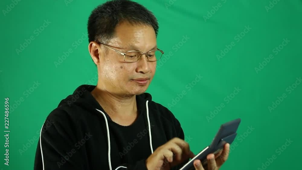 Man calculating the calculator with green screen Man calculating the calculator with green screen