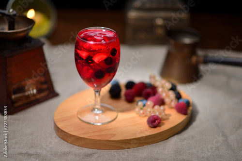 jelly with fruit in a glass on a wooden board
