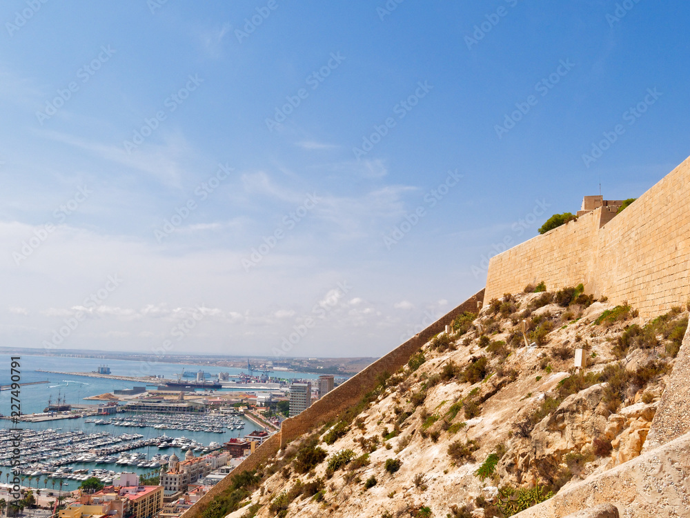 Santa Bárbara Castle (Castillo de Santa Barbara) and view of the harbor in the background in Alicante. Spain.