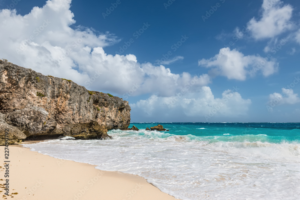 Rugged cliffs at Bottom Bay on the Atlantic south east coast of the Caribbean island of Barbados in the West Indies.