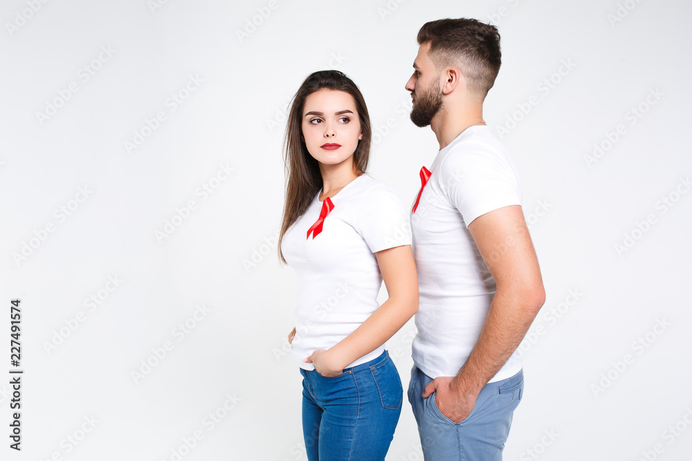 Couple supporting aids awareness together on white background Couple supporting aids awareness together on white background