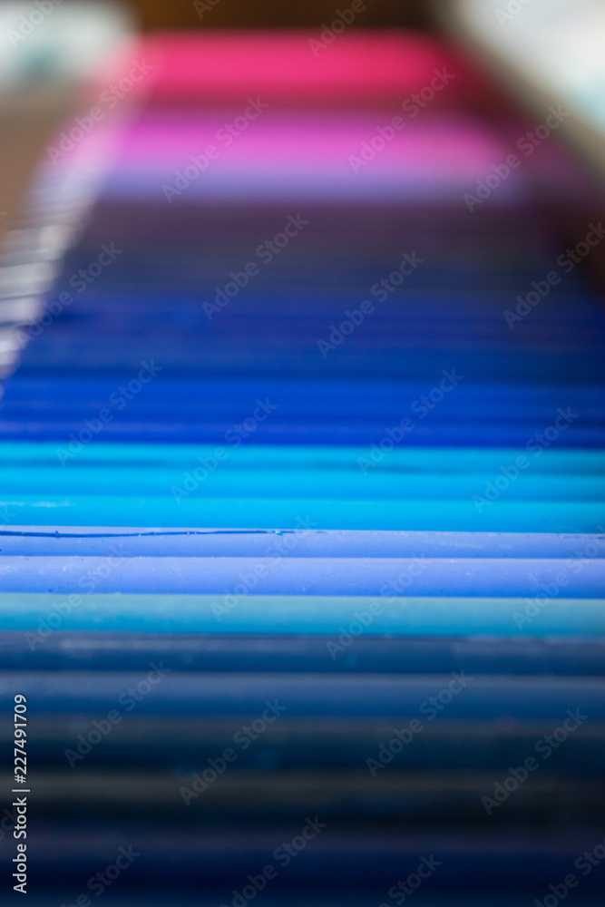 blue gradient row of crayons