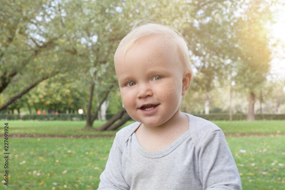Happy child boy smiling outdoor, portrait Happy child boy smiling outdoor, portrait