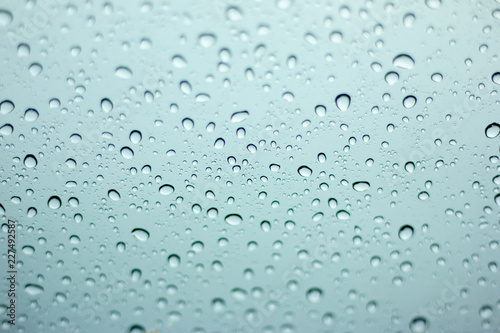 Rain drops on the windshield.