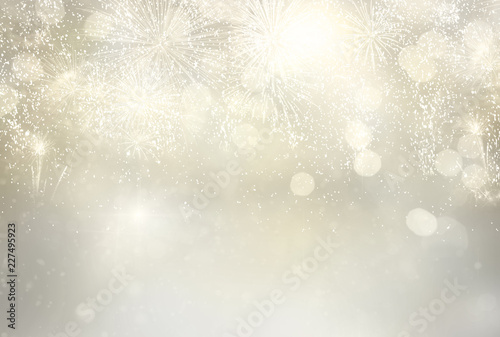 Abstract festive silver winter bokeh background with fireworks and bokeh lights