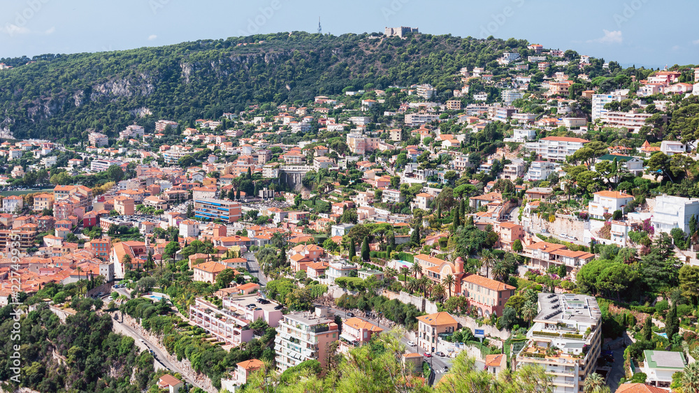 Impression of the city of Villefranche-sur-Mer with Fort du Mont Alban on top of the mountain