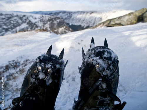 Looking over a pair of winter climbing boots to Coire Fee in the Eastern Highlands of Scotland photo