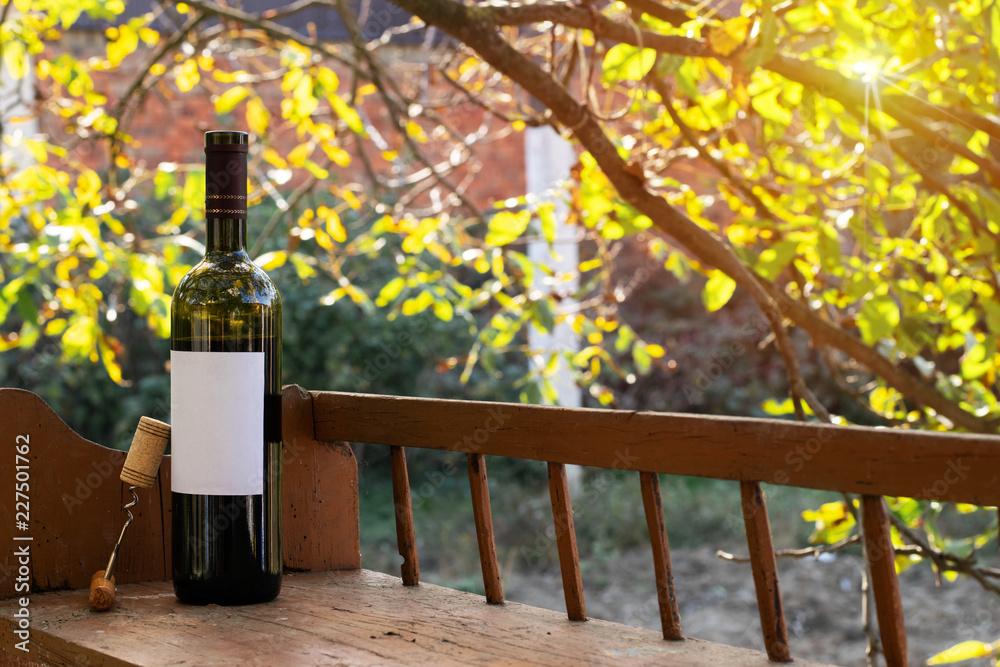 Red Wine Bottle and Wine Glass on Wodden Barrel