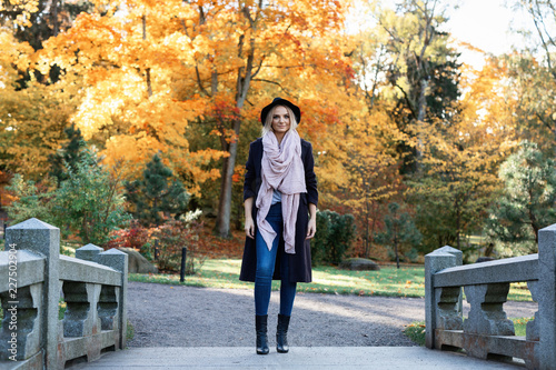 young woman enjoying autumn outdoors