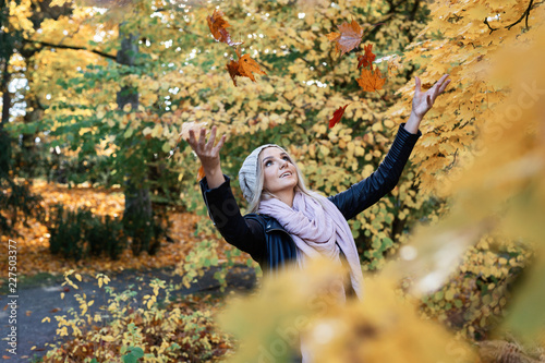 young woman enjoying autumn outdoors