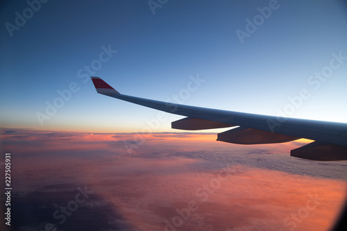 airplane in the sky at sunset