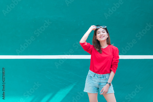 Portrait of beautiful asian woman wear skirt at tennis course,Pose for take a picture,Thailand people,Lifestyle of modern girl © reewungjunerr
