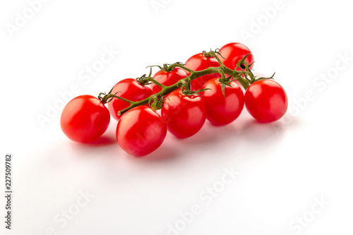 Small cherry tomato on white background. Close-up